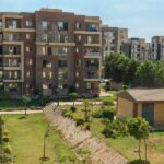 Modern apartment buildings and landscaped property showcasing real estate listings for brand growth through smart communication channels.